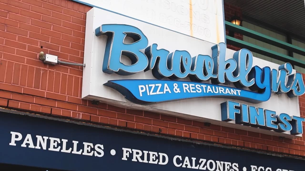 Cheese pizza on a peel at Brooklyn's Finest Pizza